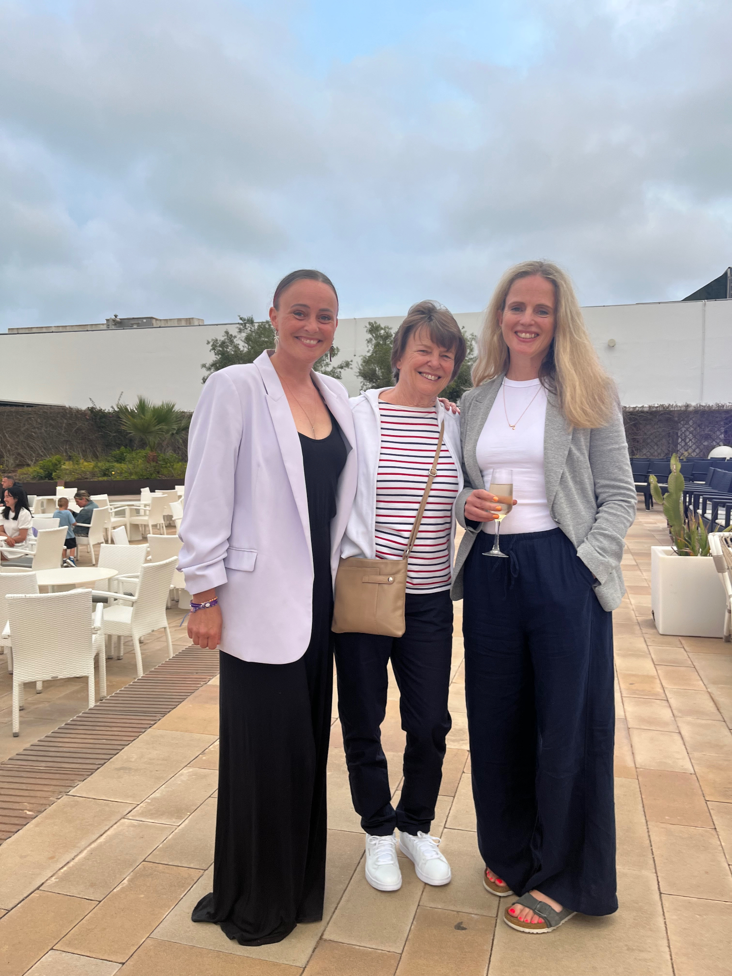 Suzy, Jill and Claire smiling together outdoors